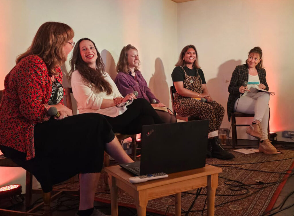 Sonic Rebellions book launch panel (photo by Paul Stapleton): 5 women sat on stage laughing together